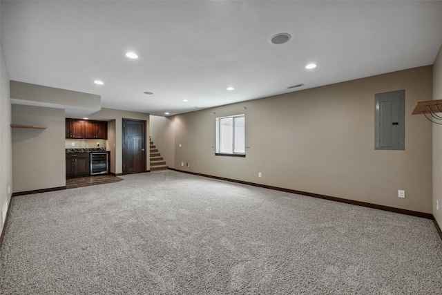 450 2nd St, Fairfax, IA 52228 - unfurnished living room featuring electric panel, wet bar, carpet, beverage cooler, and recessed lighting