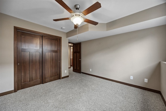 450 2nd St, Fairfax, IA 52228 - unfurnished bedroom with light carpet, a closet, and ceiling fan