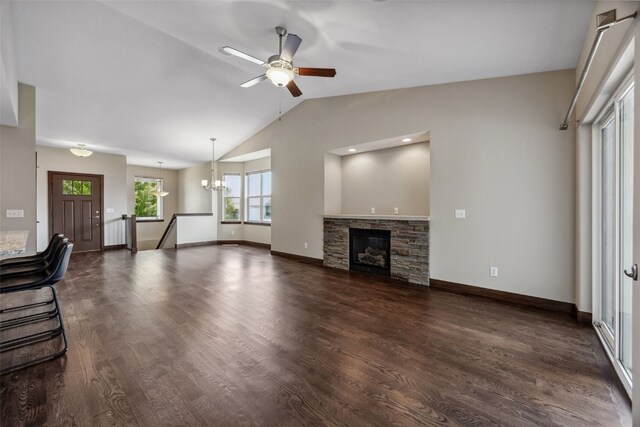 450 2nd St, Fairfax, IA 52228 - unfurnished living room with ceiling fan, lofted ceiling, a chandelier, dark wood-style floors, and a stone fireplace