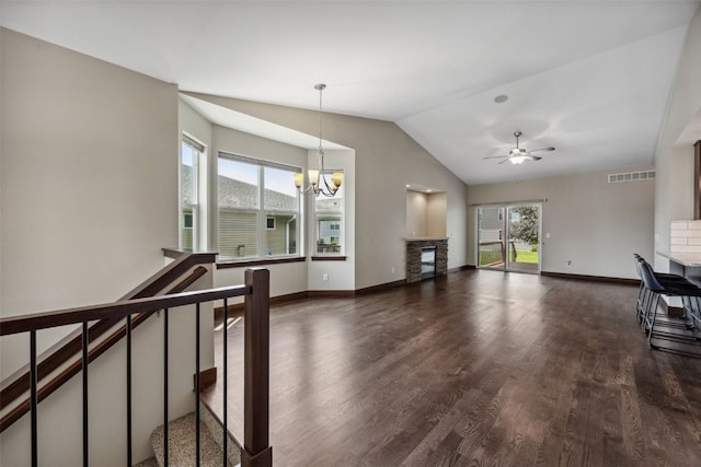 450 2nd St, Fairfax, IA 52228 - unfurnished living room with healthy amount of natural light, a chandelier, dark wood-style floors, ceiling fan, and vaulted ceiling