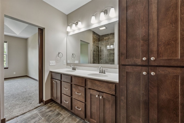 450 2nd St, Fairfax, IA 52228 - bathroom featuring double vanity and tiled shower