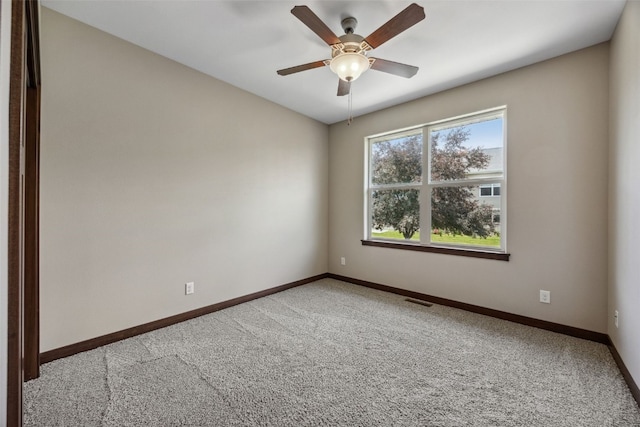 450 2nd St, Fairfax, IA 52228 - spare room featuring carpet flooring and ceiling fan