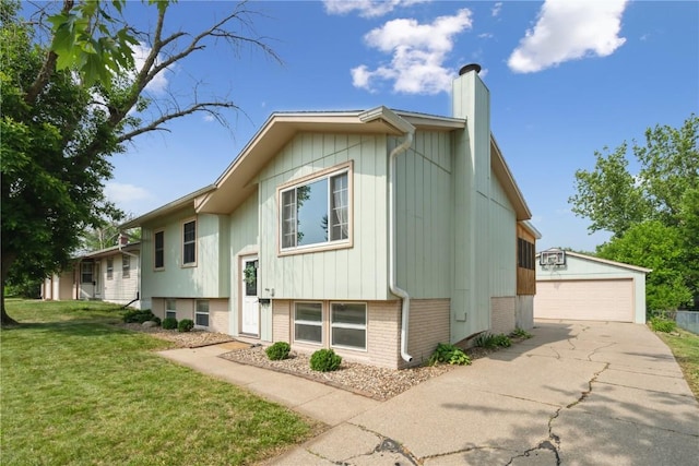 4531 Sugar Pine Dr NE, Cedar Rapids, IA 52402 - view of front of home featuring brick siding, an outbuilding, a chimney, a front yard, and a detached garage