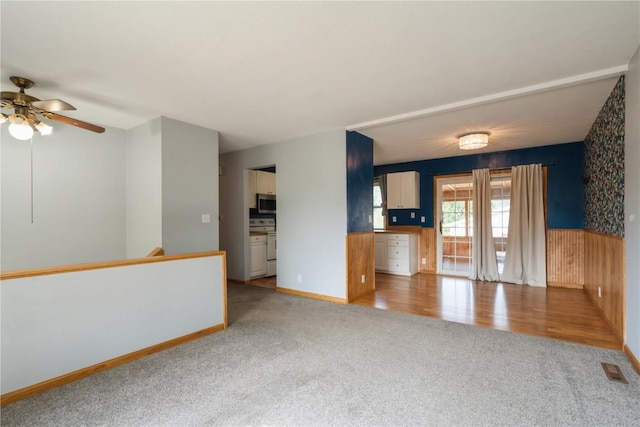 4531 Sugar Pine Dr NE, Cedar Rapids, IA 52402 - unfurnished living room featuring light carpet and a ceiling fan