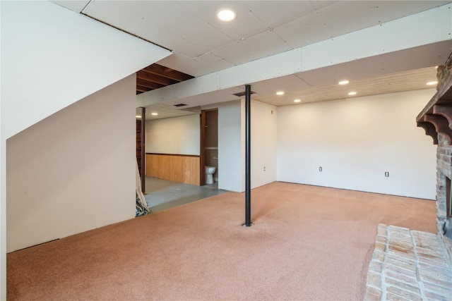 4531 Sugar Pine Dr NE, Cedar Rapids, IA 52402 - finished below grade area featuring carpet, recessed lighting, and a brick fireplace