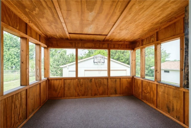 4531 Sugar Pine Dr NE, Cedar Rapids, IA 52402 - unfurnished sunroom featuring healthy amount of natural light, wooden ceiling, wooden walls, and carpet flooring