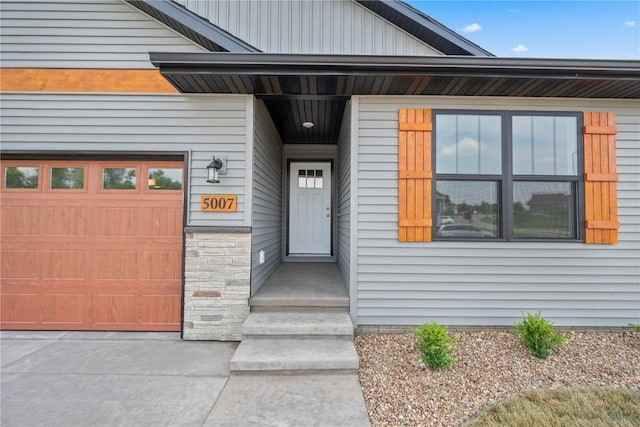 5007 Dostal Dr, Cedar Rapids, IA 52404 - property entrance with an attached garage