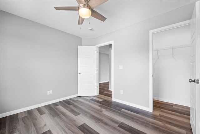 5007 Dostal Dr, Cedar Rapids, IA 52404 - unfurnished bedroom featuring wood finished floors, a closet, and a ceiling fan