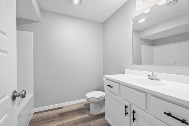 5007 Dostal Dr, Cedar Rapids, IA 52404 - bathroom featuring vanity and wood finished floors