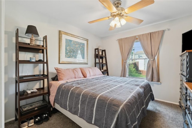 5515 Cedar Dr NW, Cedar Rapids, IA 52405 - carpeted bedroom with baseboards and a ceiling fan
