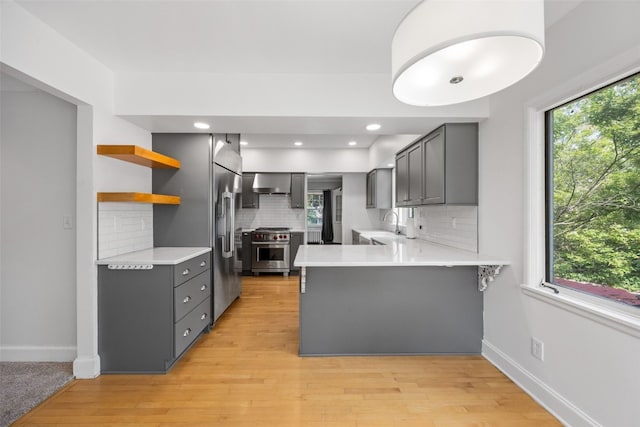 362 Garden Dr SE, Cedar Rapids, IA 52403 - kitchen featuring a peninsula, gray cabinets, appliances with stainless steel finishes, open shelves, and recessed lighting