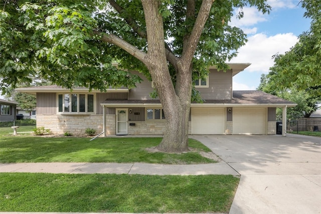 2030 26th St, Marion, IA 52302 - tri-level home featuring concrete driveway, a garage, and stone siding