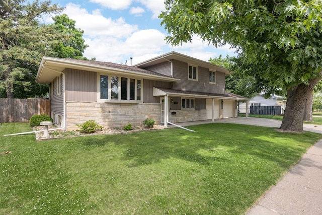 2030 26th St, Marion, IA 52302 - tri-level home with stone siding, driveway, and an attached garage
