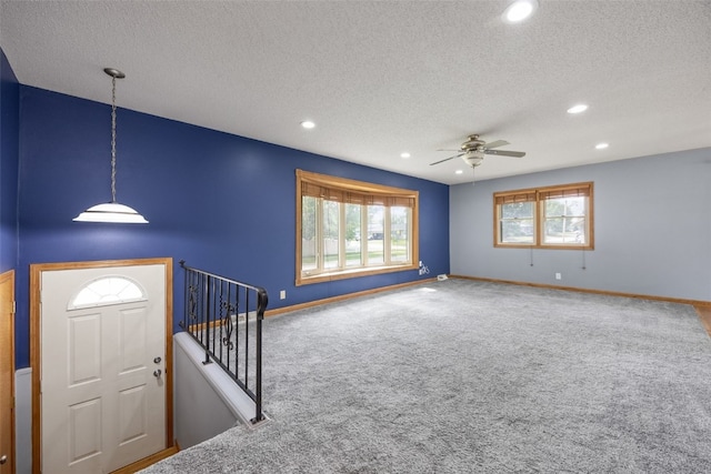 2030 26th St, Marion, IA 52302 - carpeted entrance foyer featuring a textured ceiling, a ceiling fan, and recessed lighting