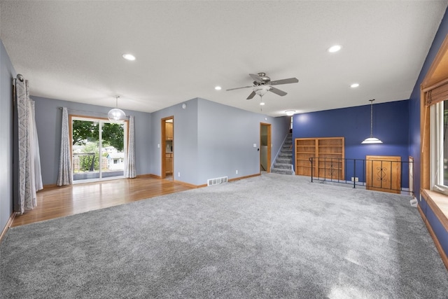 2030 26th St, Marion, IA 52302 - unfurnished living room featuring carpet, ceiling fan, recessed lighting, and stairway