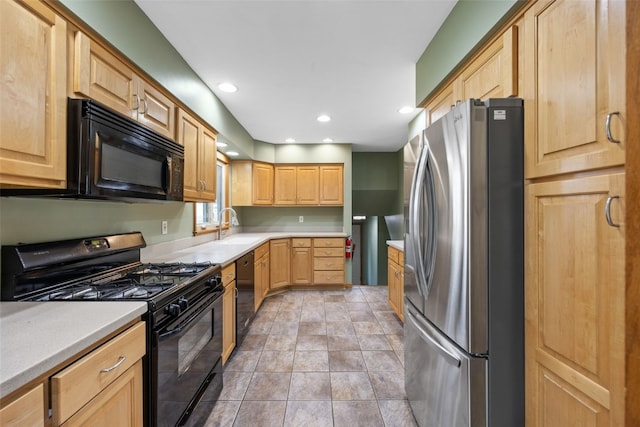 2030 26th St, Marion, IA 52302 - kitchen with black appliances, light brown cabinets, light countertops, and recessed lighting