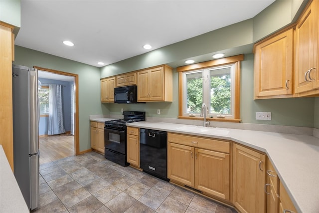 2030 26th St, Marion, IA 52302 - kitchen featuring black appliances, light countertops, recessed lighting, and light brown cabinetry