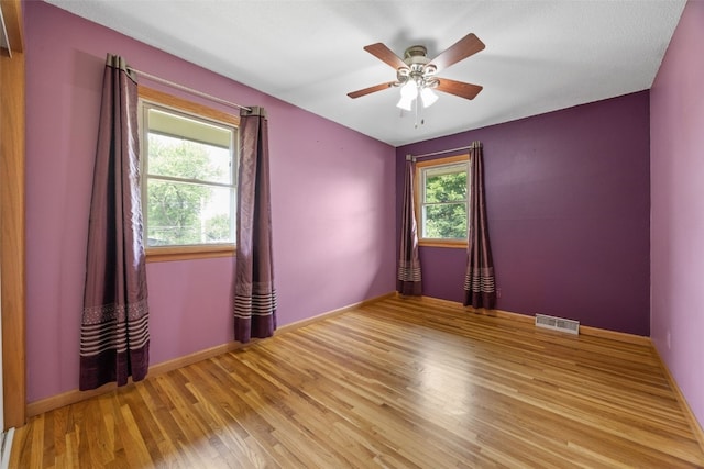 2030 26th St, Marion, IA 52302 - spare room featuring wood finished floors and a ceiling fan
