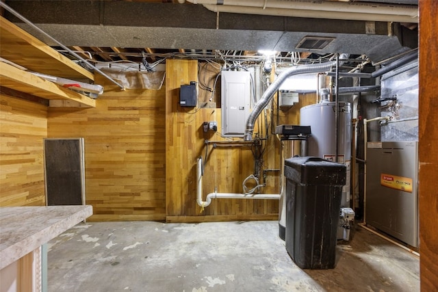 2030 26th St, Marion, IA 52302 - unfinished basement featuring electric panel, wooden walls, a water softener system, and heating unit