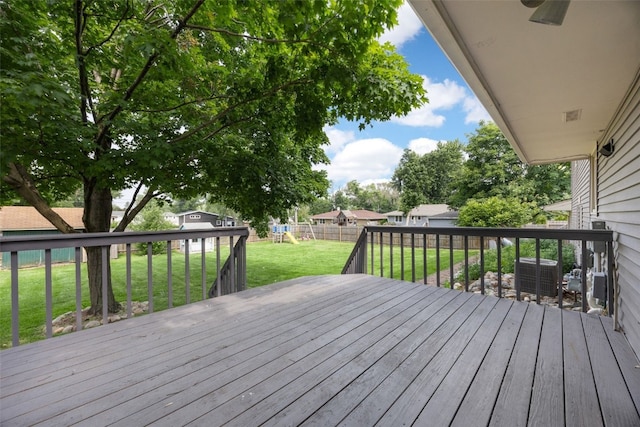 2030 26th St, Marion, IA 52302 - wooden deck featuring a playground and a fenced backyard