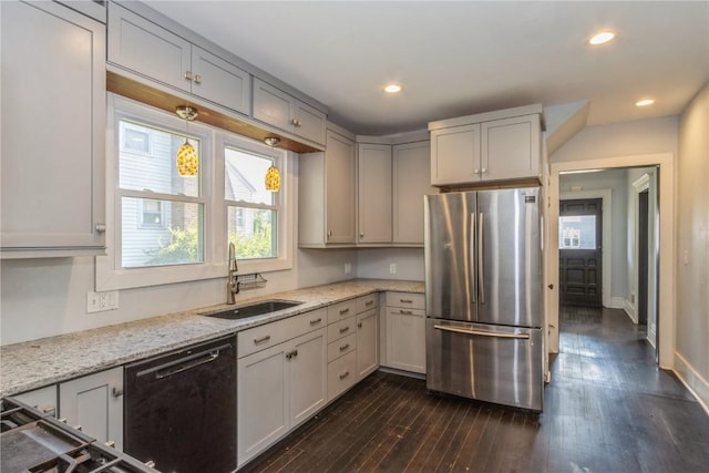 1346 11th St, Marion, IA 52302 - kitchen with freestanding refrigerator, black dishwasher, dark wood finished floors, light stone counters, and recessed lighting
