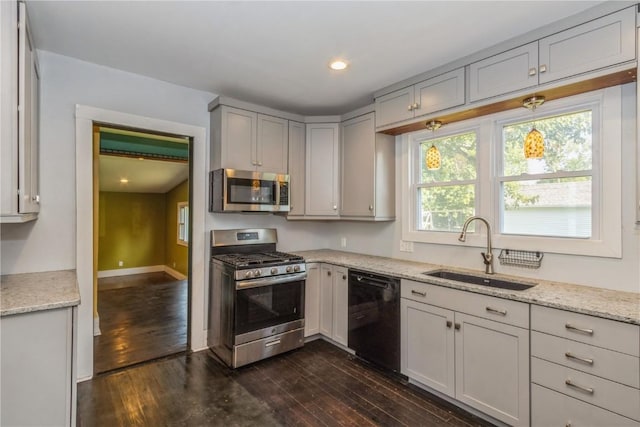 1346 11th St, Marion, IA 52302 - kitchen featuring stainless steel appliances, dark wood-type flooring, light stone counters, and recessed lighting