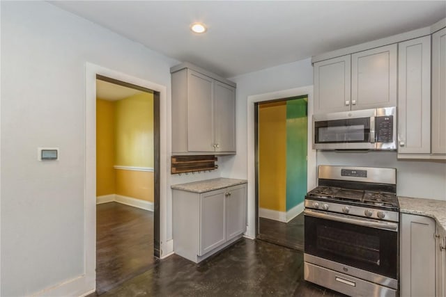 1346 11th St, Marion, IA 52302 - kitchen with stainless steel appliances, gray cabinetry, light stone countertops, and recessed lighting