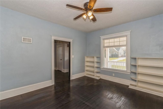 1346 11th St, Marion, IA 52302 - unfurnished room with wood finished floors, ceiling fan, and a textured ceiling
