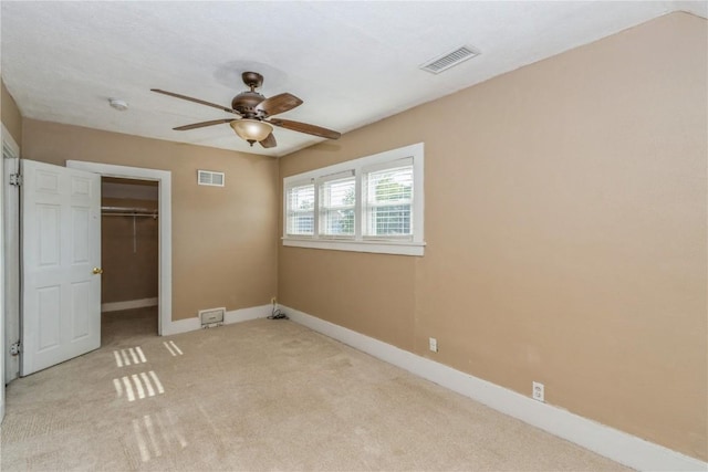 1346 11th St, Marion, IA 52302 - unfurnished bedroom featuring carpet flooring, a closet, ceiling fan, and a spacious closet