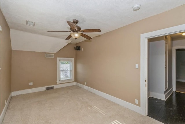 1346 11th St, Marion, IA 52302 - carpeted spare room featuring a ceiling fan, lofted ceiling, and a smoke detector