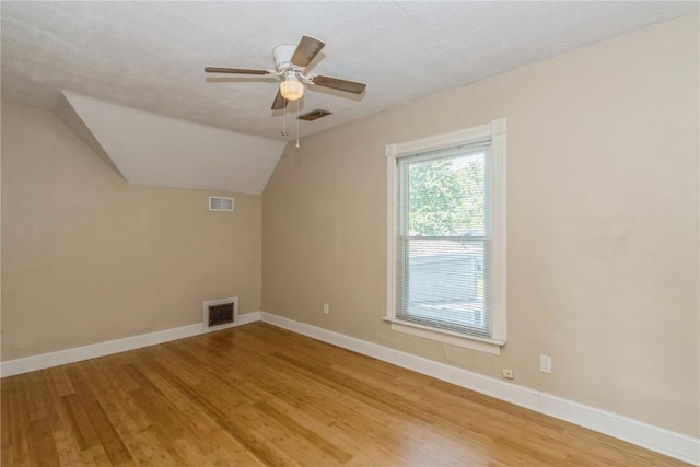 1346 11th St, Marion, IA 52302 - bonus room with wood finished floors, ceiling fan, and vaulted ceiling