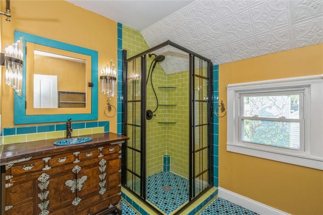 1346 11th St, Marion, IA 52302 - bathroom with a stall shower, vanity, and tile patterned floors