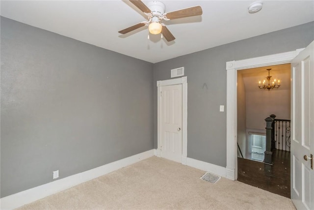 1346 11th St, Marion, IA 52302 - unfurnished bedroom featuring a chandelier, carpet flooring, and a ceiling fan