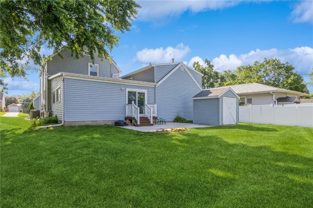 1346 11th St, Marion, IA 52302 - back of property featuring entry steps, a storage unit, and a patio