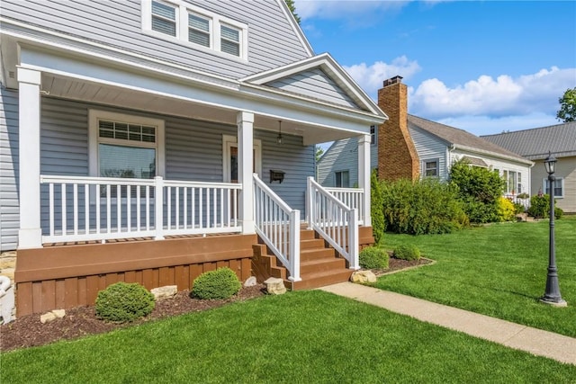 1346 11th St, Marion, IA 52302 - view of front facade featuring a porch and a front yard