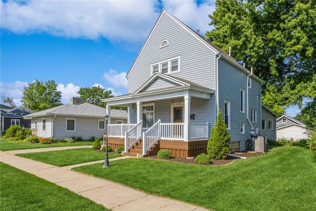 1346 11th St, Marion, IA 52302 - view of front of house featuring a porch and a front lawn