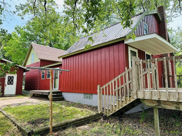 109 Pine St NW, Blairstown, IA 52209 - view of property exterior featuring board and batten siding and an outdoor structure