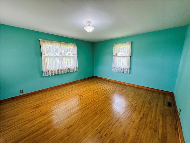 109 Pine St NW, Blairstown, IA 52209 - spare room with wood finished floors and baseboards