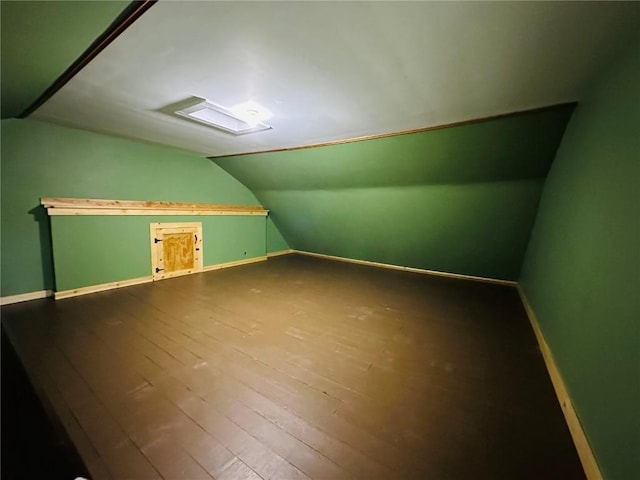 109 Pine St NW, Blairstown, IA 52209 - additional living space featuring lofted ceiling and dark wood-type flooring