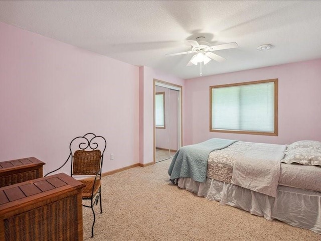 3387 64th St, Palo, IA 52324 - bedroom featuring light colored carpet, a closet, and a ceiling fan