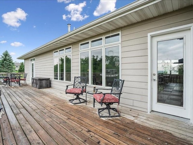 3387 64th St, Palo, IA 52324 - wooden terrace with outdoor dining area
