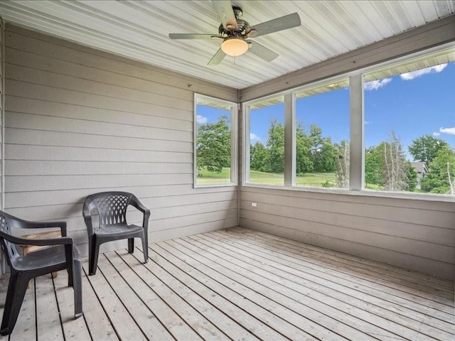 3387 64th St, Palo, IA 52324 - sunroom / solarium with ceiling fan, hardwood / wood-style flooring, and wood walls