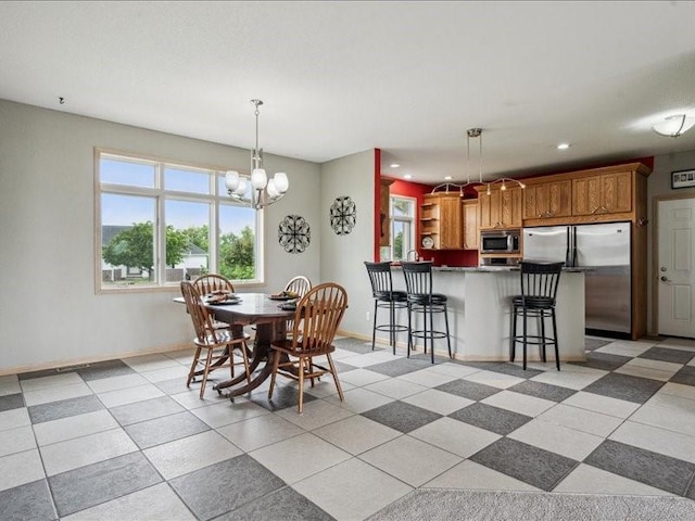 3387 64th St, Palo, IA 52324 - dining area with a chandelier and recessed lighting