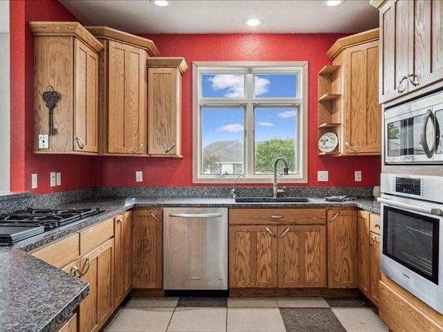 3387 64th St, Palo, IA 52324 - kitchen featuring stainless steel appliances, recessed lighting, dark countertops, and brown cabinetry