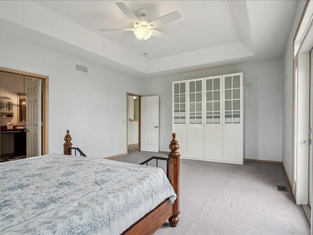3387 64th St, Palo, IA 52324 - bedroom featuring carpet floors, a raised ceiling, and ceiling fan