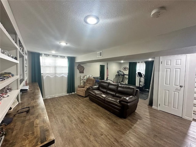 6706 Boxwood Ln NE, Cedar Rapids, IA 52402 - living area with a textured ceiling and wood finished floors