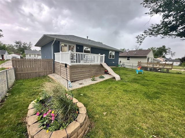 6706 Boxwood Ln NE, Cedar Rapids, IA 52402 - rear view of property with a wooden deck