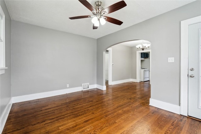 1612 Greene Ave NE, Cedar Rapids, IA 52402 - spare room featuring arched walkways, a ceiling fan, wood finished floors, and a chandelier