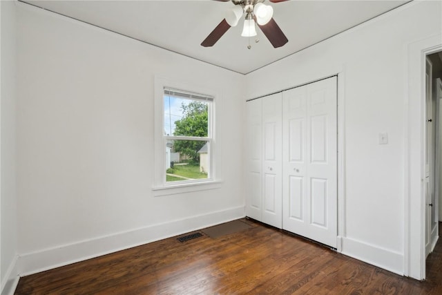 1612 Greene Ave NE, Cedar Rapids, IA 52402 - unfurnished bedroom with dark wood-style floors, a closet, and ceiling fan