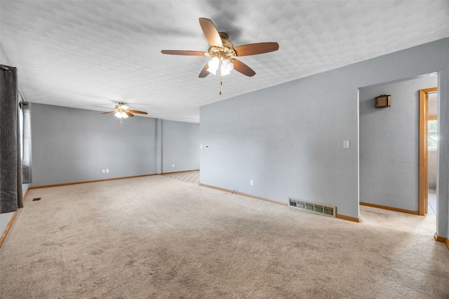 203 B Ave, Newhall, IA 52315 - spare room with a ceiling fan and carpet flooring